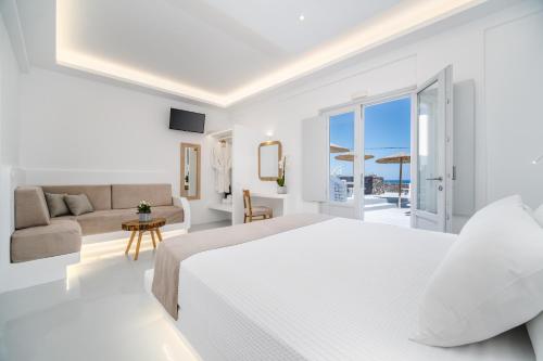 Postel nebo postele na pokoji v ubytování Serenità Luxury Suites