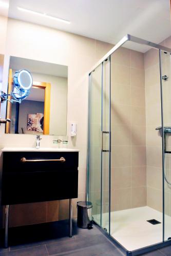 a bathroom with a shower and a sink at 6 Bis HOTEL in Castelldefels