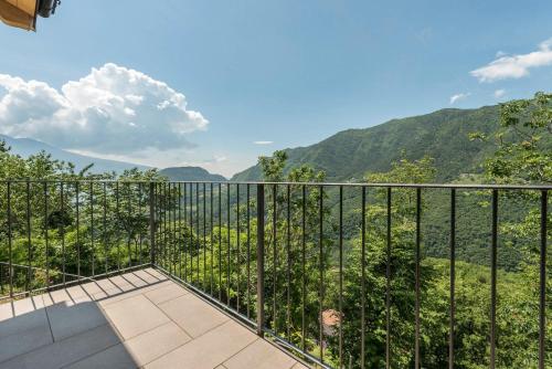 a balcony with a view of the mountains at Nonno Bigi Tulipano in Tremosine Sul Garda