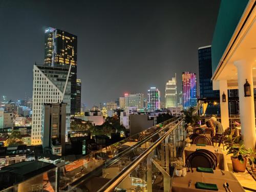 
a city street filled with lots of tall buildings at The Odys Boutique Hotel in Ho Chi Minh City
