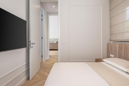 Ένα ή περισσότερα κρεβάτια σε δωμάτιο στο Plaza Apartments
