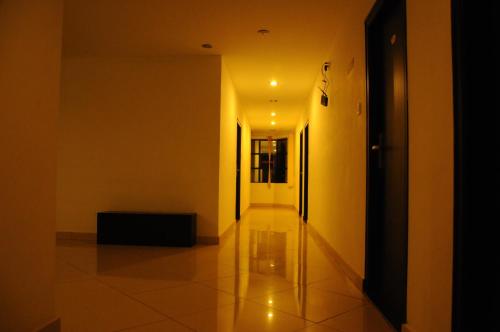 a hallway of a building with a light on the ceiling at Hotel Sri Krishna Residency in Udupi