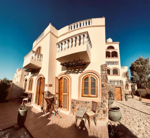 a large white house with two balconies on it at Villa 22 in Dahab