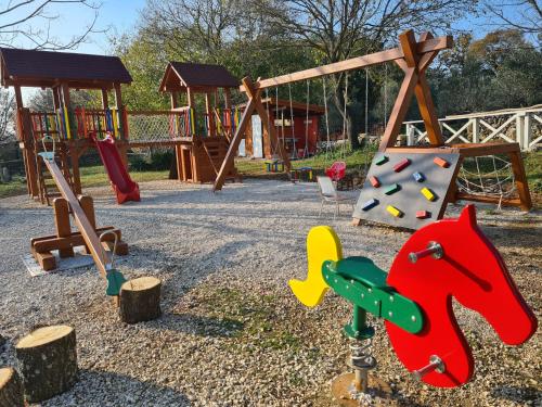 a playground with several different types of playground equipment at Mobile Homes Dvor in Manjadvorci