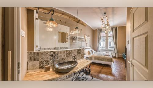 Postel nebo postele na pokoji v ubytování Boutique Suites Ráday