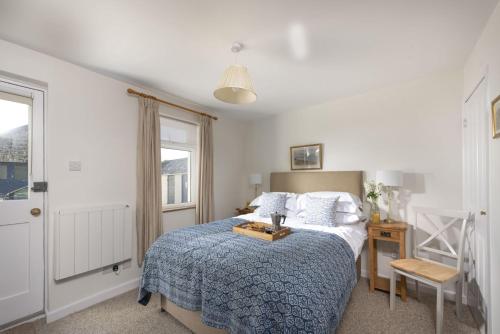 Una cama o camas en una habitación de Greenfields Coach House