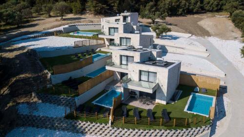 an aerial view of a house with a swimming pool at The Euphoria Club Luxury Villas in Pefkochori