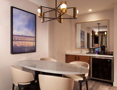 a dining room with a table and chairs at Grand Hyatt Nashville in Nashville