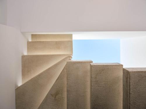 a group of concrete stairs in a building at SAVVAS & JOANNA BOUTIQUE in Laganas
