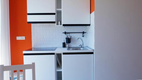 Talìa Residenceにあるキッチンまたは簡易キッチン