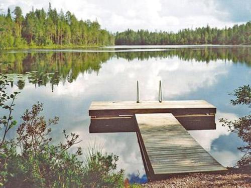 a dock in the middle of a lake at Holiday Home Ullanlinna by Interhome in Käylä