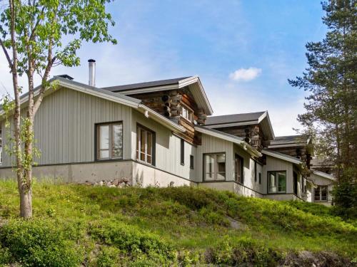 a house on top of a hill at Holiday Home Rukapahta 15 by Interhome in Ruka