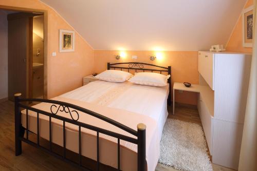 Ein Bett oder Betten in einem Zimmer der Unterkunft Villa Bepo i Ivo