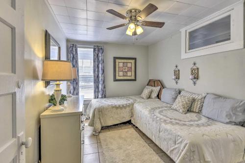 a living room with a bed and a couch at Crescent City Apartment with Easy Lake Access! in Crescent City