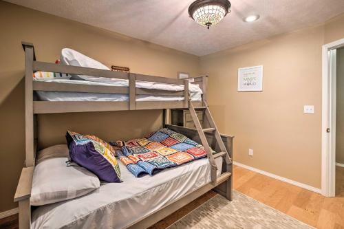a bedroom with two bunk beds in a room at Holiday Island Home Fire Pit and Boat Parking! in Golden