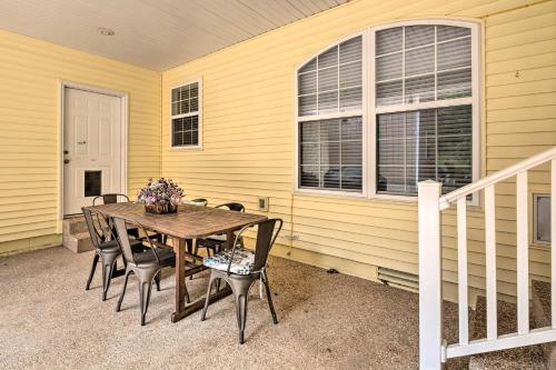 a table and chairs in front of a house at Holiday Island Home Fire Pit and Boat Parking! in Golden