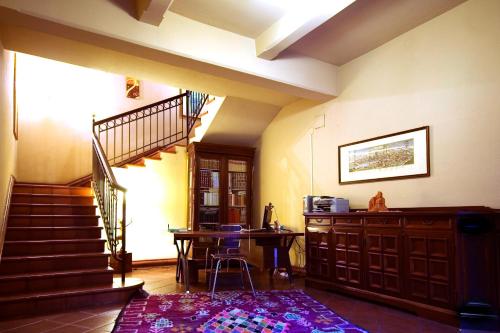 a living room with a staircase and a table at Casa Canale in Reggio Calabria