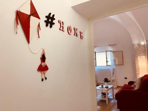 a kite hanging on a wall in a living room at Perla Barocca Centro Storico Mesagne in Mesagne