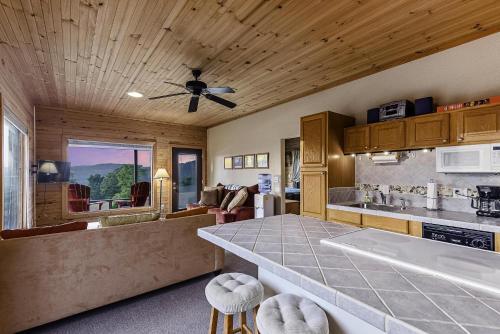 a kitchen with a counter and a ceiling fan at This is the ultimate in private escape in Ponca