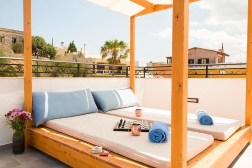 a couch on the roof of a building at Hotel Port 7- Boutique Collection in Agios Nikolaos