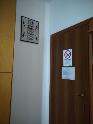 a close up of a door with signs on it at Sa Sindria in Cagliari