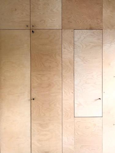 a wooden floor with two doors on it at Villa Stjerneklar in Copenhagen