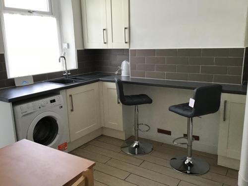 Kuchyň nebo kuchyňský kout v ubytování Cosy end terrace