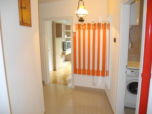 a hallway with an orange radiator in a house at Apartment 33 in Belgrade