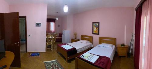 Cama o camas de una habitación en Klodi Apartament