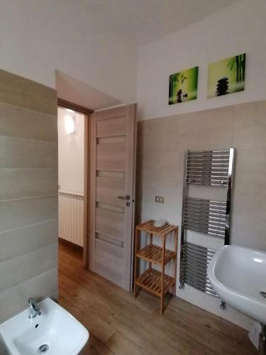 a bathroom with a white sink and a toilet at the Mainstreet in Agerola