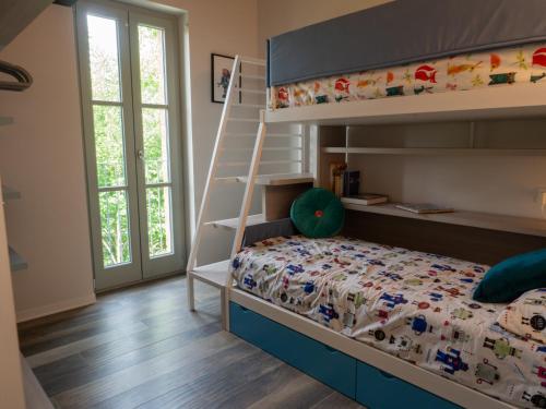 Poschodová posteľ alebo postele v izbe v ubytovaní Villa Ersilia nel cuore del Chianti Senese