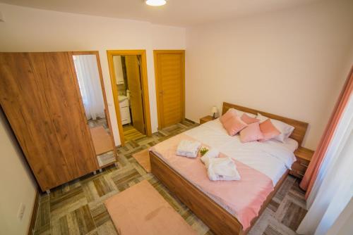a bedroom with a bed with two pillows on it at Užički konak in Užice