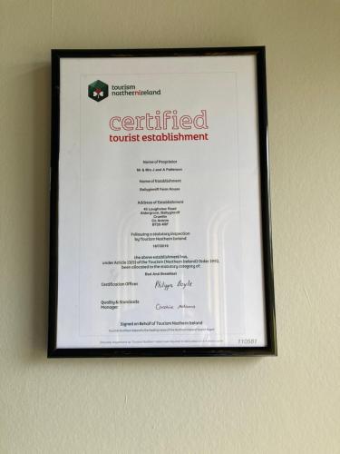 a framed certificate hanging on a wall at Ballyginniff Farm House in Crumlin
