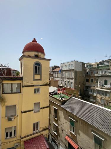 a building with a red dome on top of it at Hotel Europeo Napoli in Naples