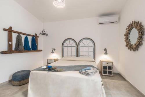 a bedroom with a large bed in a room at B&B Antico Telaio in Santa Maria Navarrese
