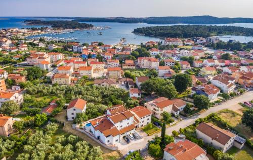 an aerial view of a town with a river and houses at Villa Asta Medulin in Medulin