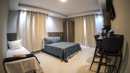 Tempat tidur dalam kamar di Flats Catamarã