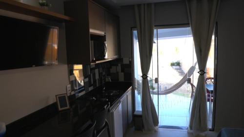 Dapur atau dapur kecil di Flats Catamarã