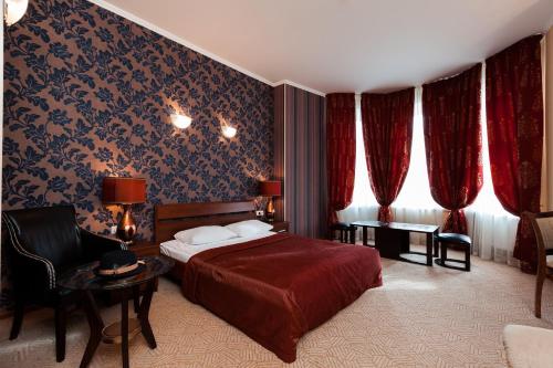 Ένα ή περισσότερα κρεβάτια σε δωμάτιο στο Allegro Ligovsky Prospekt