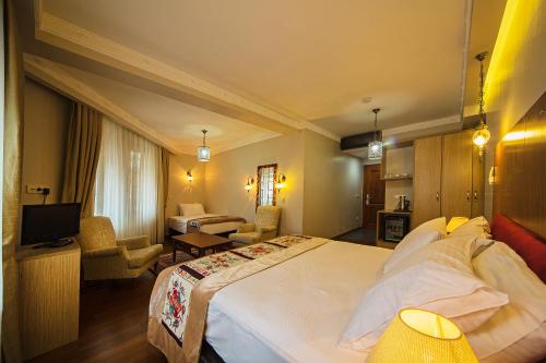 Ένα ή περισσότερα κρεβάτια σε δωμάτιο στο Apart Hotel Hippodrome