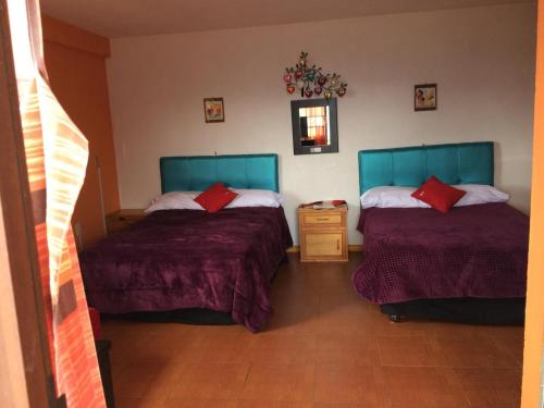 Ein Bett oder Betten in einem Zimmer der Unterkunft Hotel Vista Markés