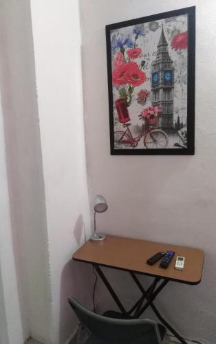 a desk in a room with a picture on the wall at Santa Rosa 4Rest in Monterrey