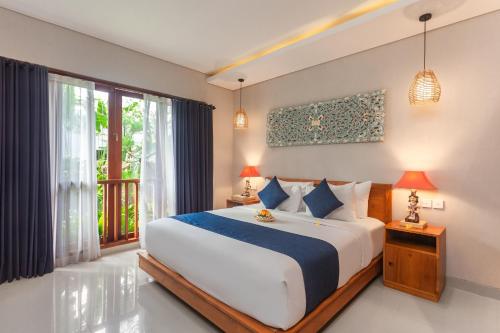 Postel nebo postele na pokoji v ubytování Ning Villa Ubud by GenuineHost