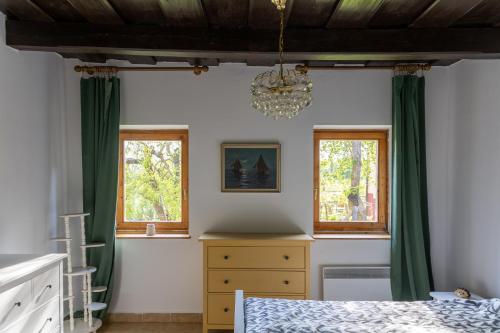 Tempat tidur dalam kamar di Tulipán Vendégház Kercaszomor