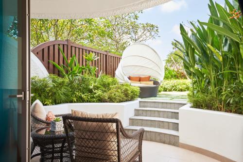 a patio with stairs and plants and a boat at Shangri-La Singapore in Singapore