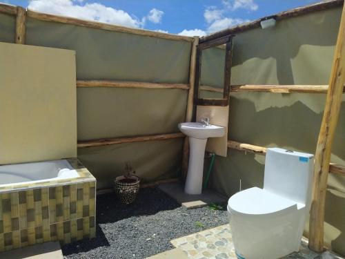 a bathroom with a toilet and a sink at Amanya Camp 1 Double -Bed Tiger in Amboseli in Amboseli