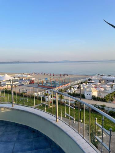 a view of the beach from the balcony of a resort at La Baia Di Ulisse in Venetico