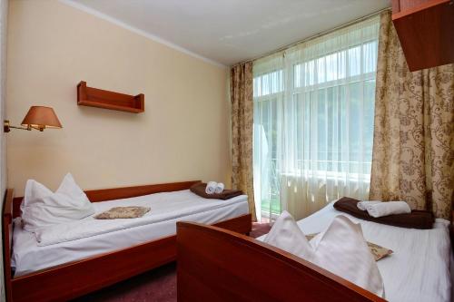 Postel nebo postele na pokoji v ubytování Mazowsze Medi Spa