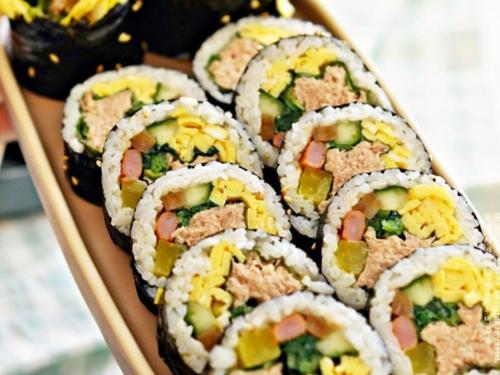 a tray filled with sushi on top at Oyado Fubuki in Nozawa Onsen