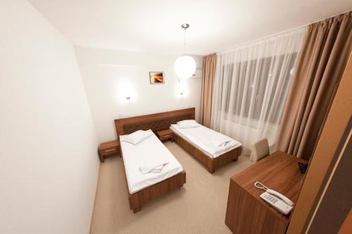Postel nebo postele na pokoji v ubytování Hotel Mariss
